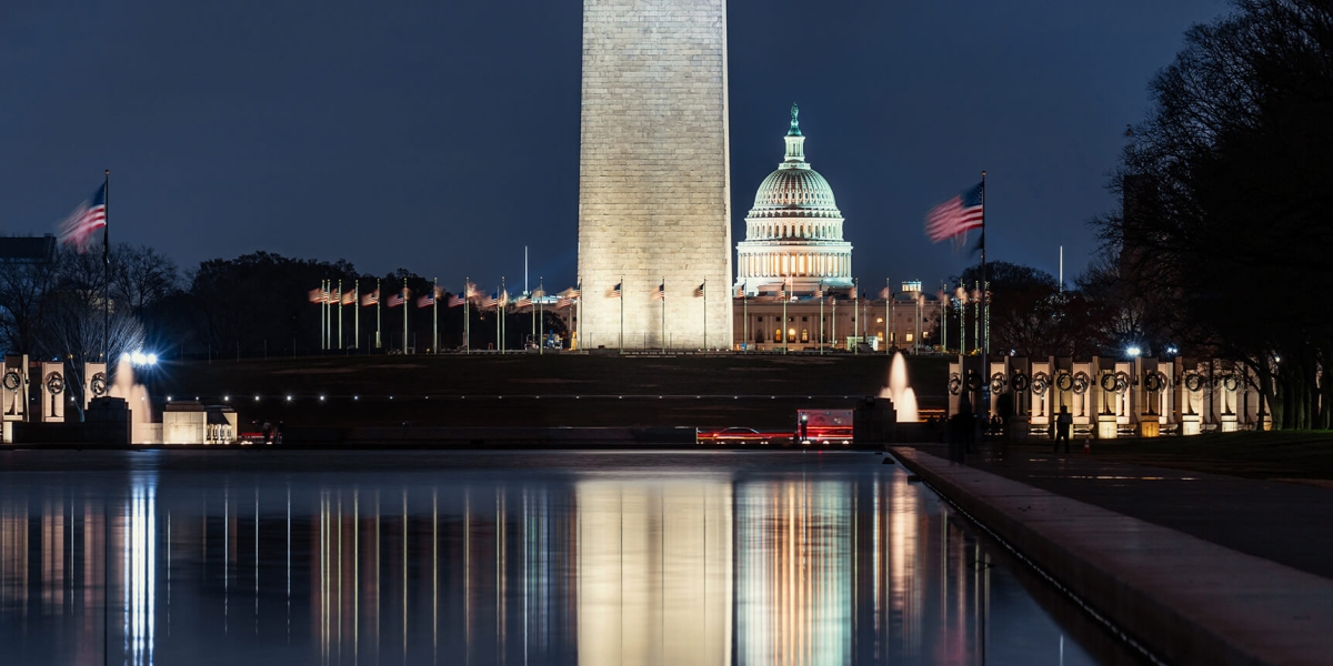 The US Capitol Building with Washington Monument with US Flag